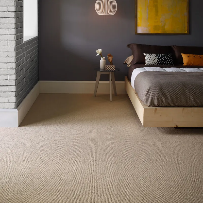 Beige wool wall-to-wall carpet in modern bedroom