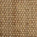 Close-up of a densely woven natural beige jute carpet texture.