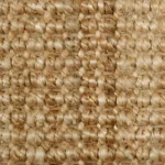 Close-up of a natural tan jute carpet texture