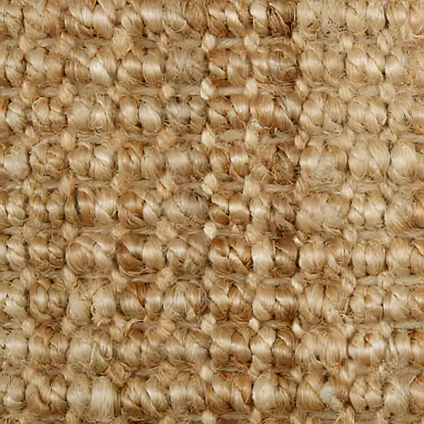 Close-up of a natural tan jute carpet texture
