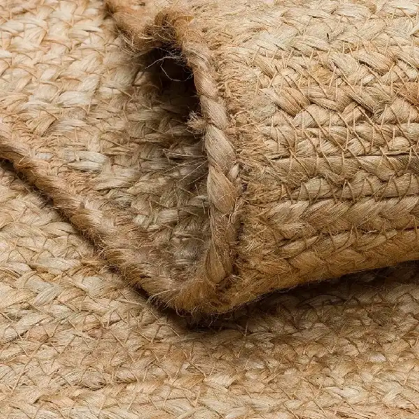 Close-up of a tightly braided natural jute carpet edge.