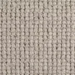 Close-up texture of a chunky grey wool loop pile carpet.