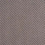 Close-up texture of a deep charcoal wool herringbone carpet.