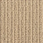 Close-up texture of a warm beige wool loop pile carpet.