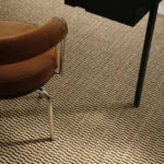 Harvest Natural White wall to wall carpet under office desk
