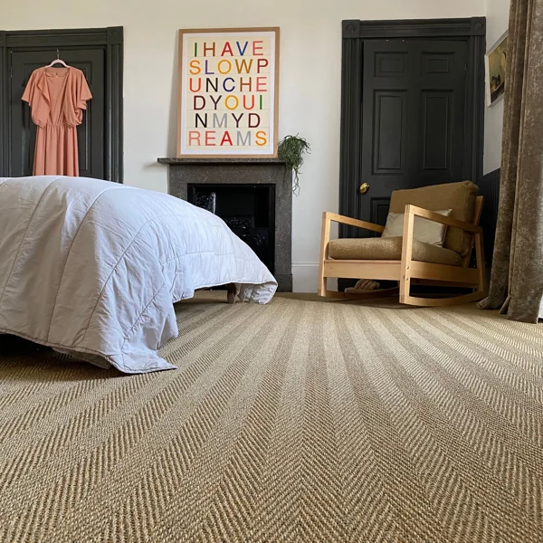 Herringbone sisal wall to wall carpet in stylish room