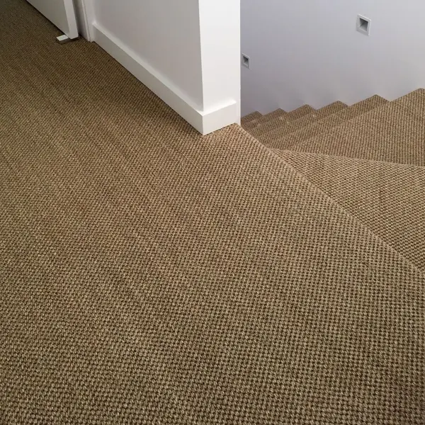 Jute wall to wall carpet installed on staircase landing