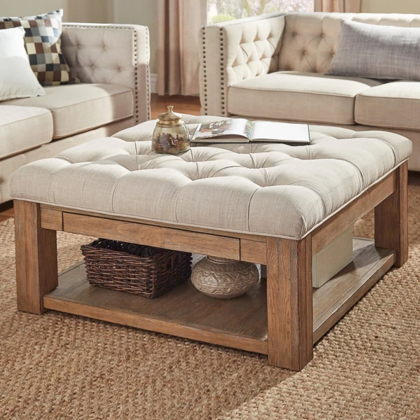 Textured natural jute carpet flooring beneath a wooden and tufted upholstered coffee table
