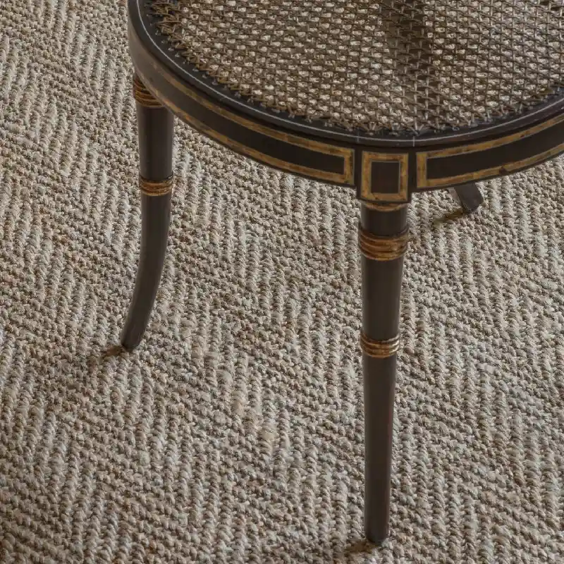 Textured natural jute carpet with a close-up view of woven fibers