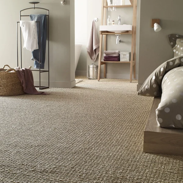 Textured sisal wall to wall carpet in cosy bedroom