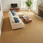 sisal wall-to-wall carpet installed in a bright modern living room with a beige sectional sofa